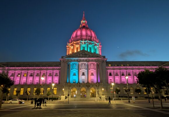 PXL_20260702_041517711 San Francisco City Hall lit up in Alliance for Smiles colors