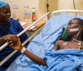 Relieved mom with son in PACU