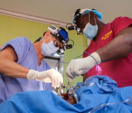 Dr. Eric Helling operates alongside his Nigerian counterpart
