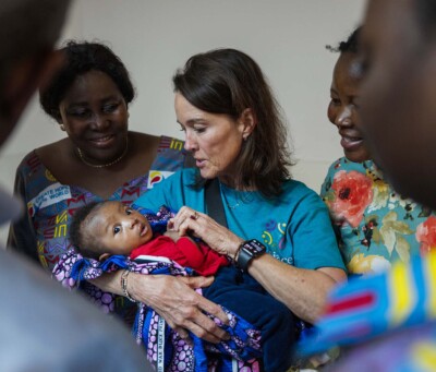 AfS’ Tina Fischlin carries baby