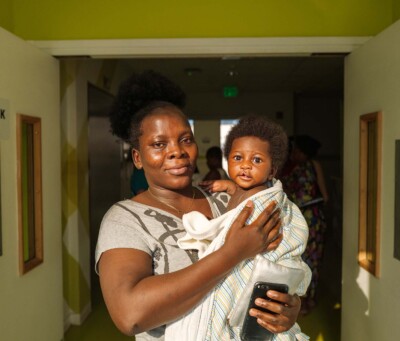 Mom swaddles child